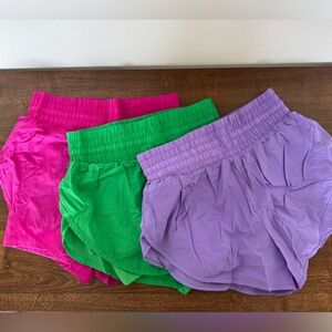 Hot pink flowy liner shorts (left)